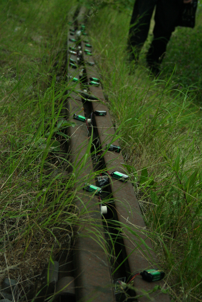 Ikuru Takehashi's small devices laid out on a railway track