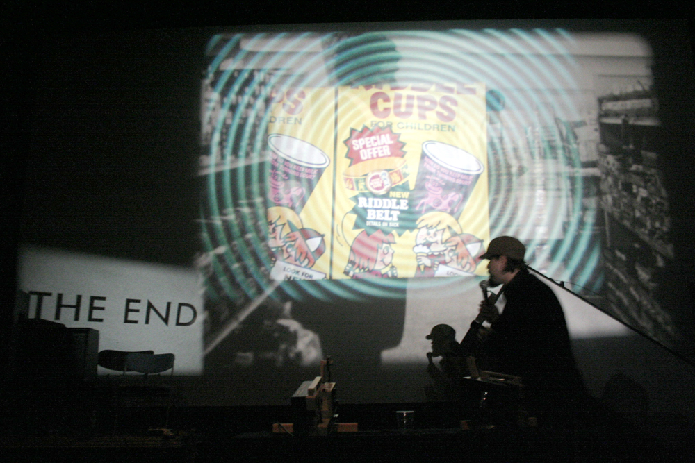 Cups for children advert projected on a wall