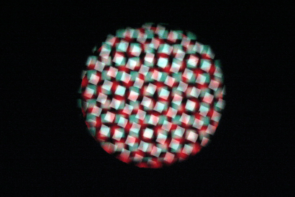 A projected circle of light made up of fragments, patterns