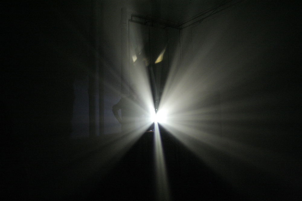 Light spreading out from a projector in breams white