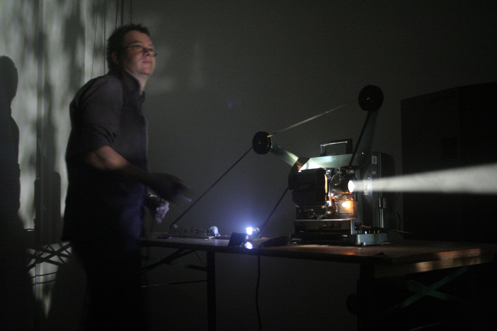 Greg Pope operating a projector