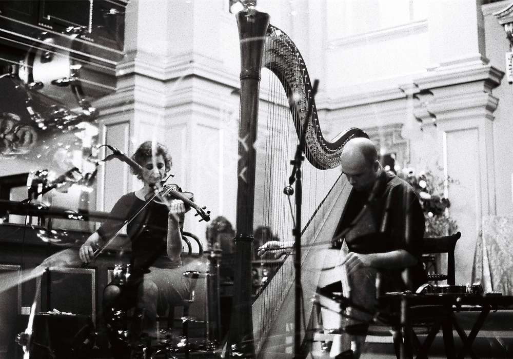 Angharad and Rhodri performing in St Giles in the Fields on violin and harp