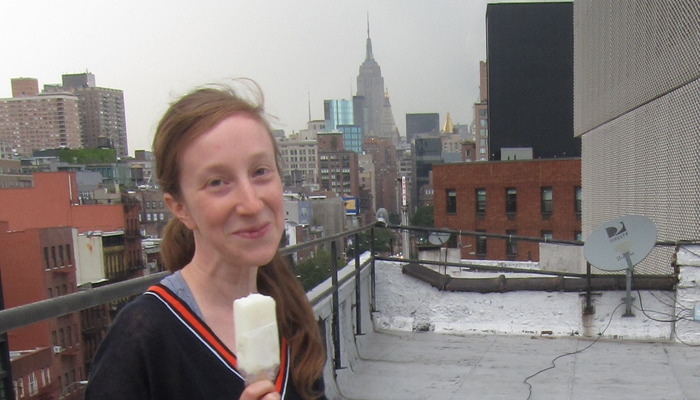 Amalle on a rooftop in NY holding an ice cream