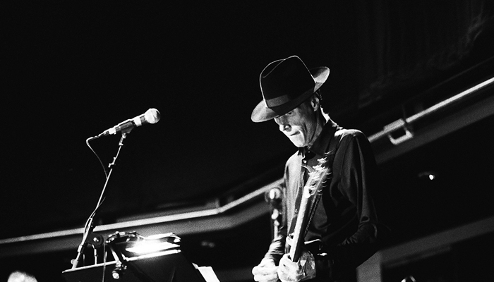 Jandek playing a guitar at MLFC