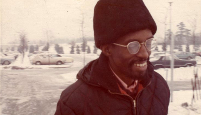 Julius Eastman wearing a hat and glasses