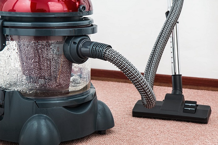 vacuuming kitchen floor
