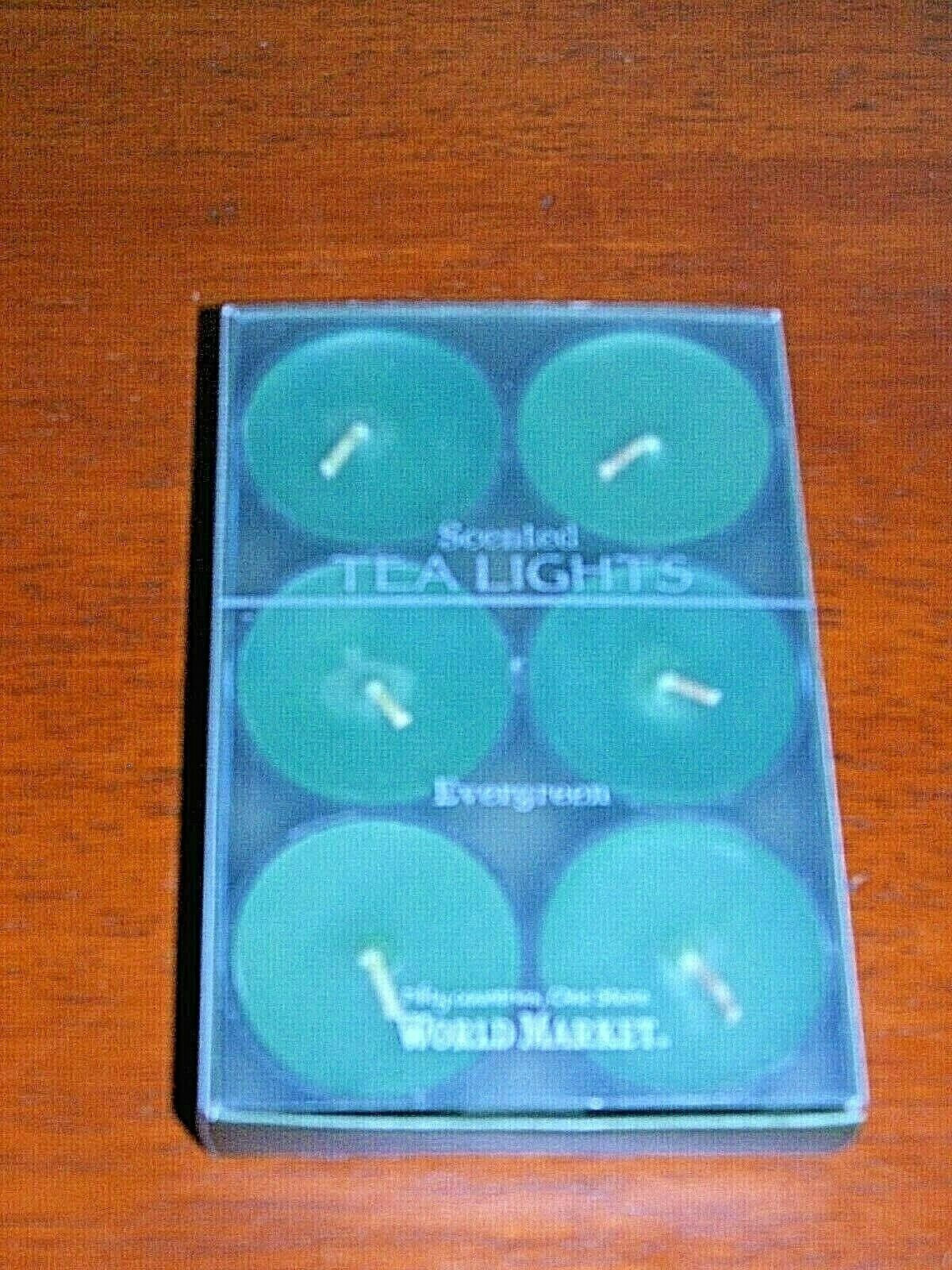 new in box with tag WORLD MARKET EVERGREEN 6 pack Tealight Candles