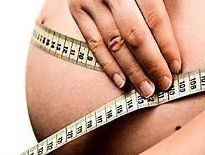 Mengapa perut berhenti tumbuh pada wanita hamil?