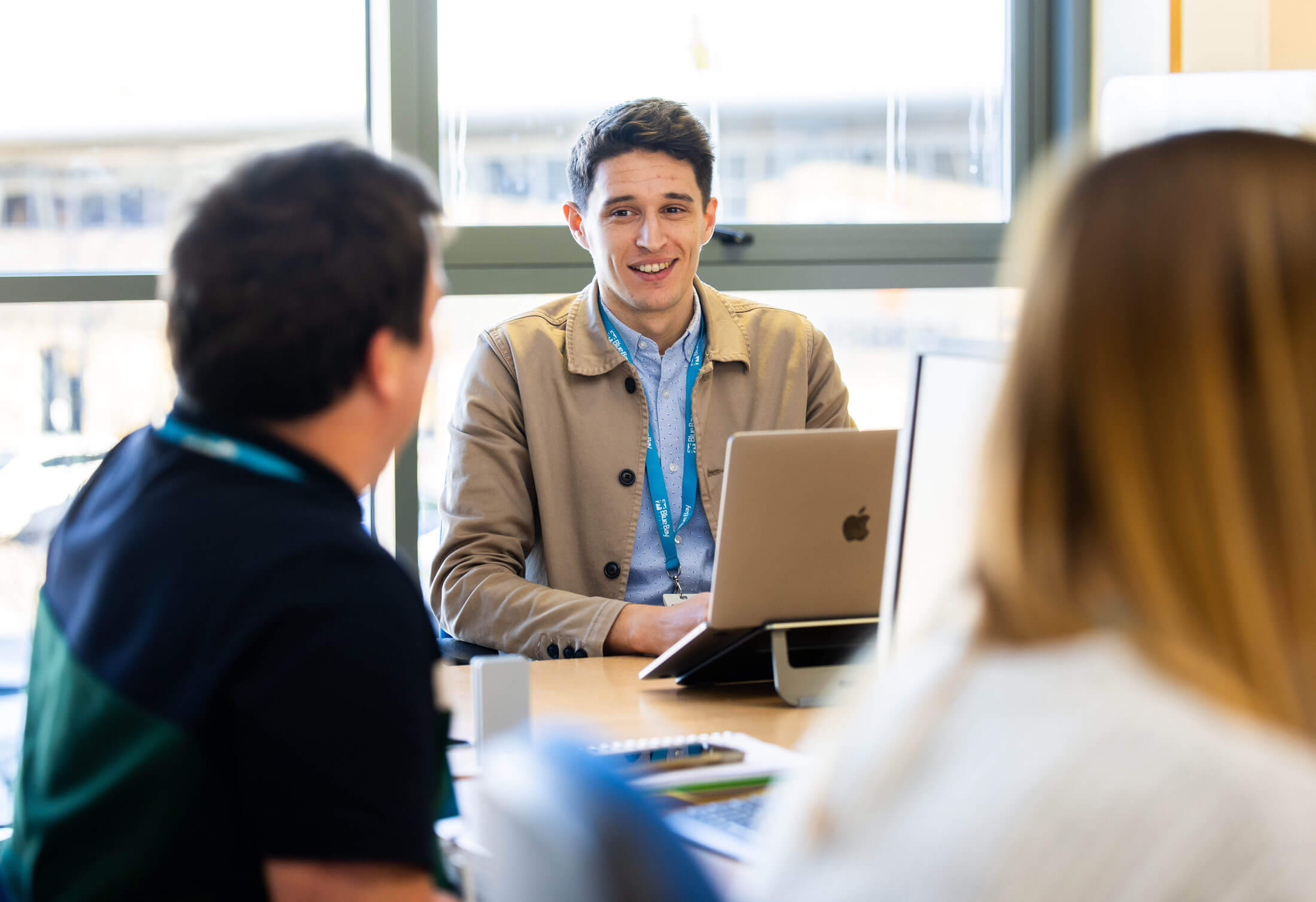 The Head of Brand & Development engaging with his team