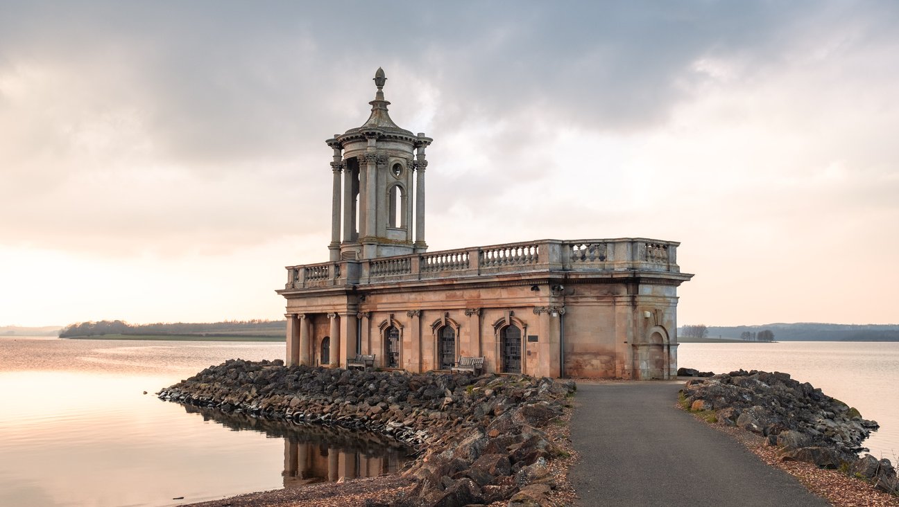 

                                        church building set on a lake