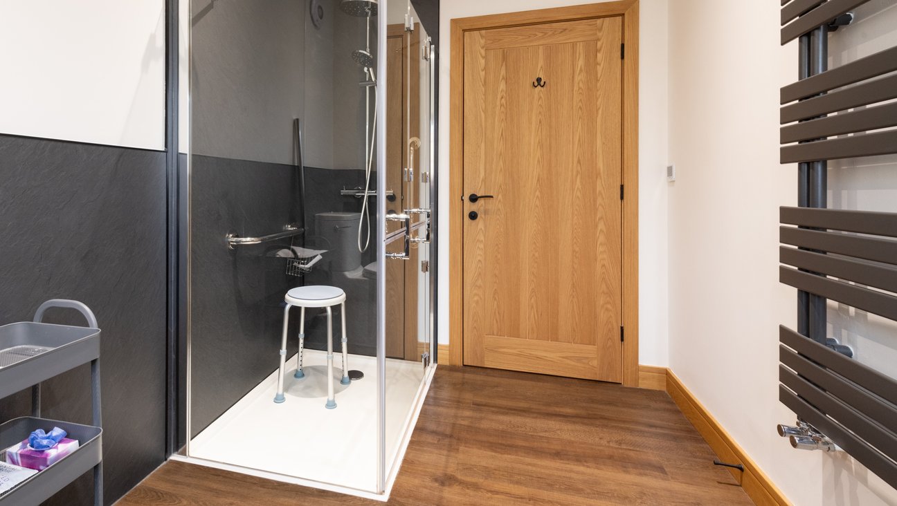 

                                        AKW Shower with swivel seat shower stool. The room has a turning circle of 1.3 metres with a large transfer space for wheelchair users.