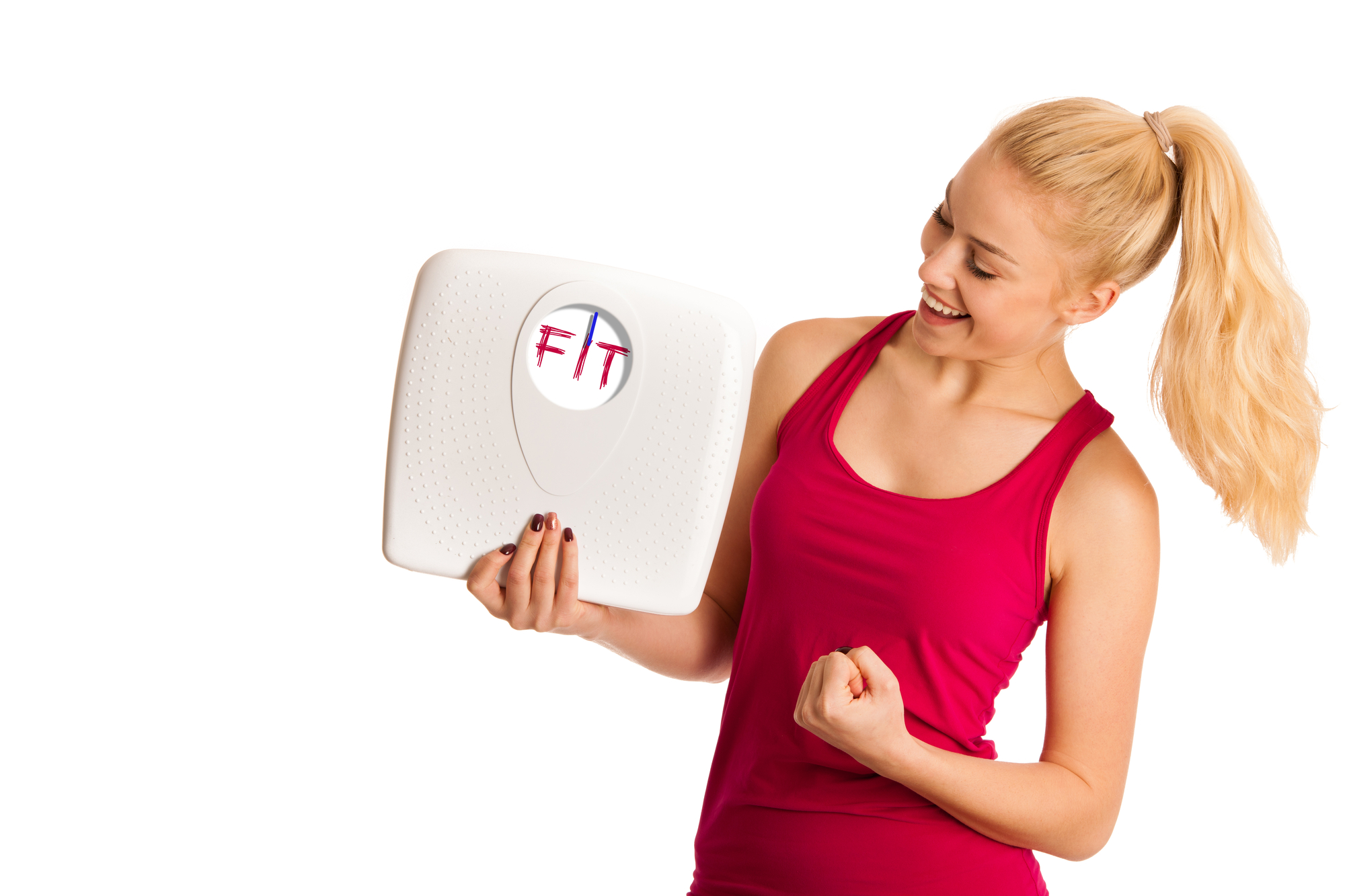 weight loss plateau breakthrough smiling woman holding scale