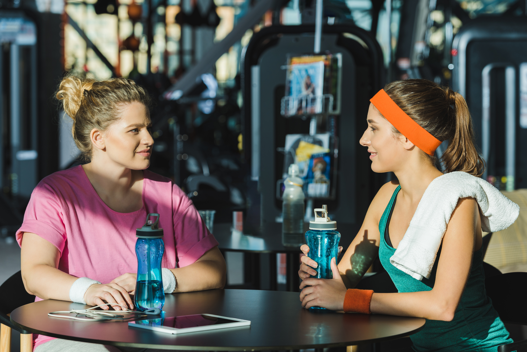 weight loss motivation - two women with sports water bottles sitting
