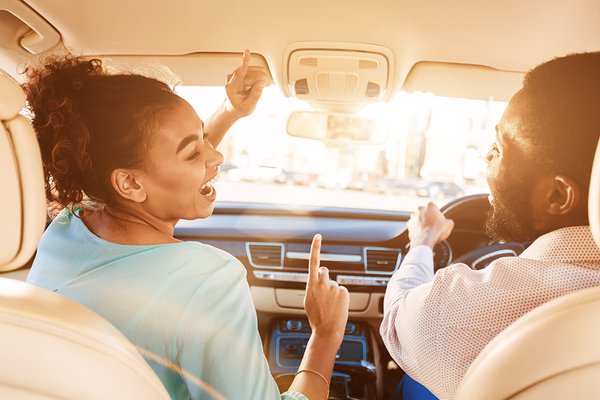 Couple driving and laughing