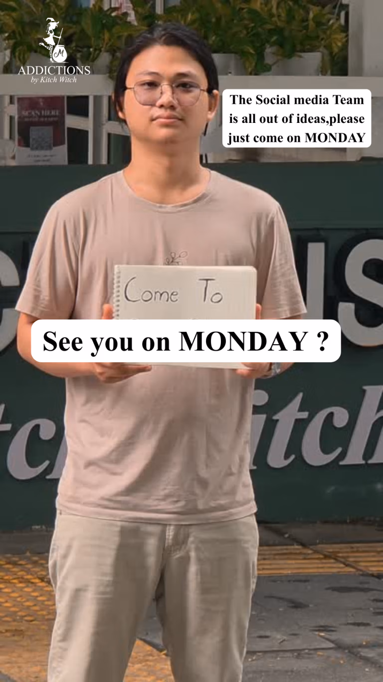 Stephen standing outside with sign