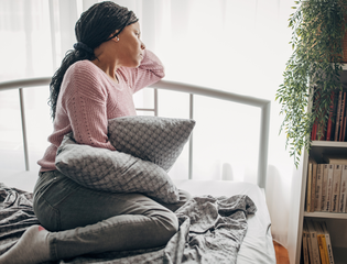 Women on the bed and looking out the women