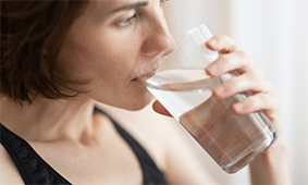 Woman drinking glass of water