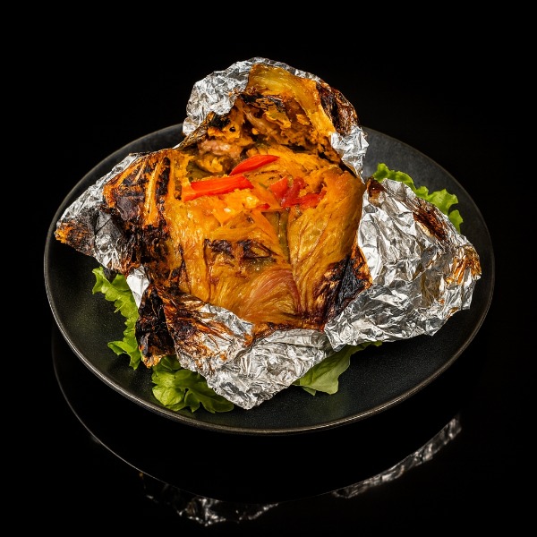 35. Poulet en papillotte au jus de coco