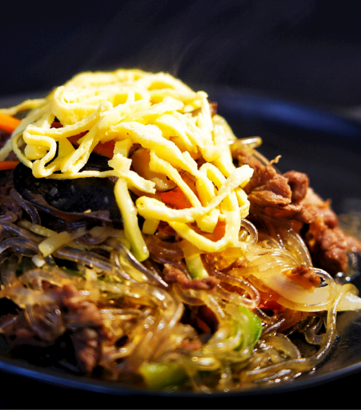 E9. Nouilles de patate douce sautées au boeuf et aux légumes