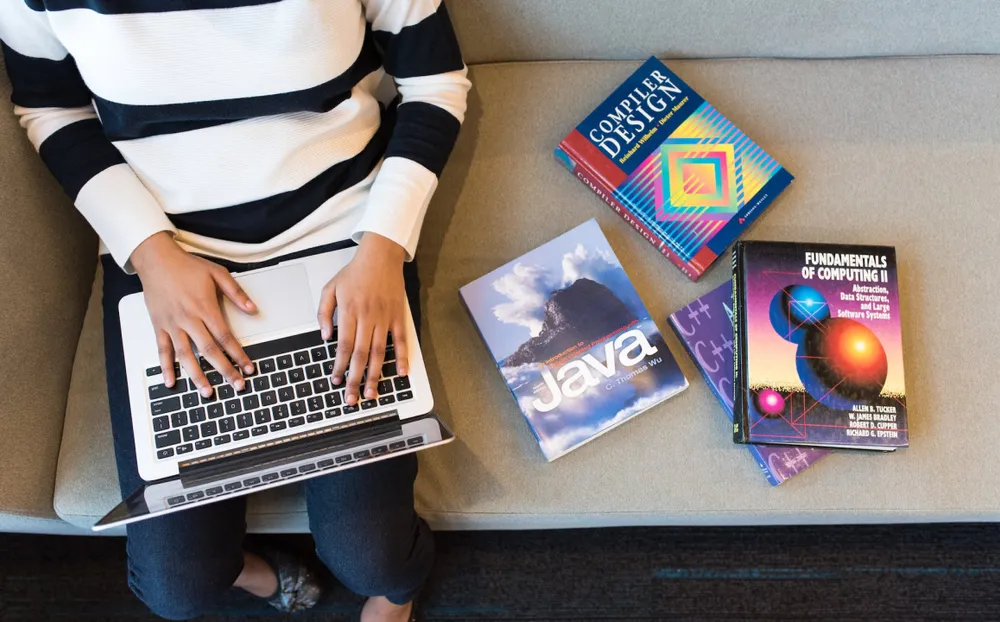 A developer studying with a laptop