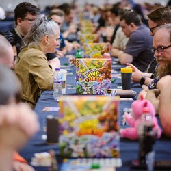 People playing in a King of Tokyo board game tournament